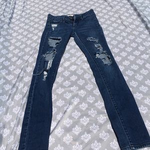 Distressed dark wash jeans
